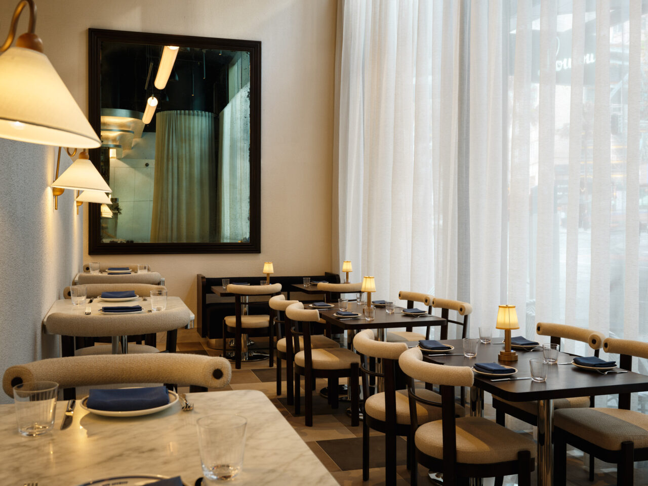 A softly lit dining corner at Loulou Martin Place